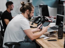 Young Men Working on Computers and Tablets for Managed IT Services in Carlsbad, CA